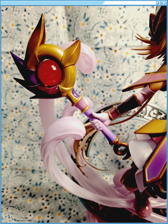 Closeup of her staff