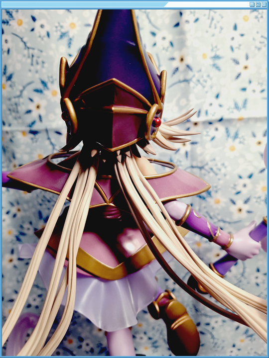 Shot of the back of her outfit, and hair.