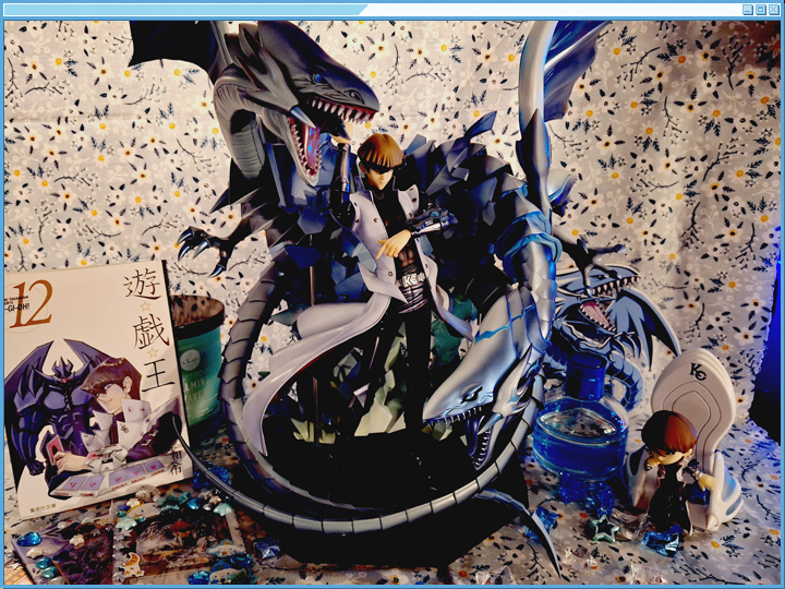 Decorated photo of Kaiba and his dragons